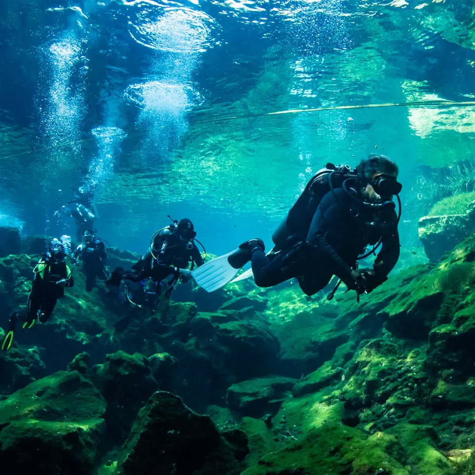 Diver under the sunbeams of Cenote Ponderosa