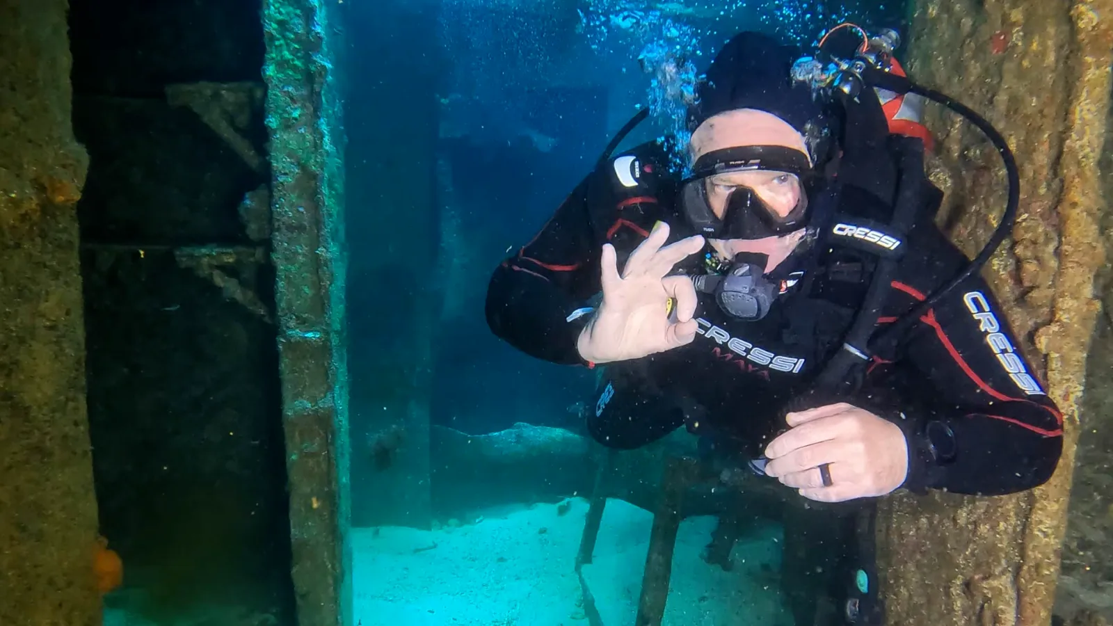 Diver signalling OK inside the C-58 minesweeper wreck off Cancun